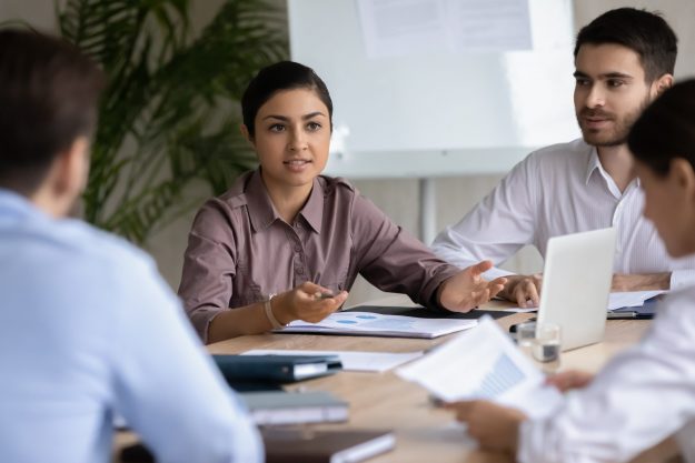 Attractive,Indian,Ethnic,Businesswoman,With,Businessman,Partner,Talking,In,Boardroom